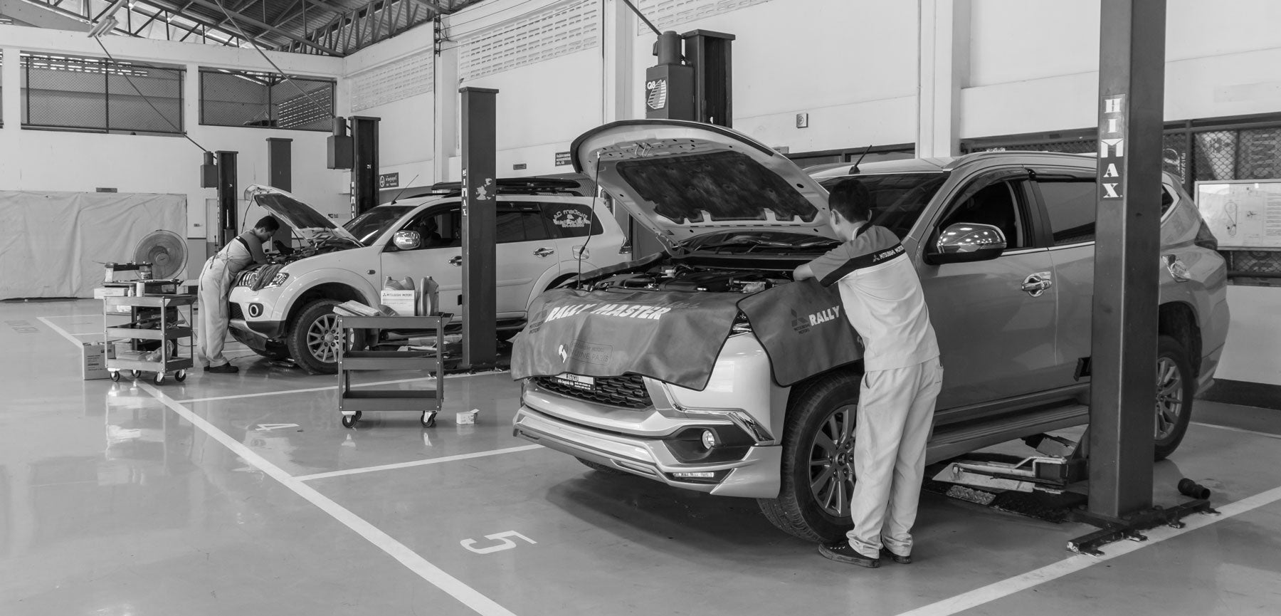 A car being checked out by someone.