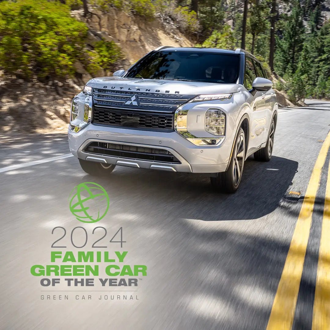 a white suv driving on the road