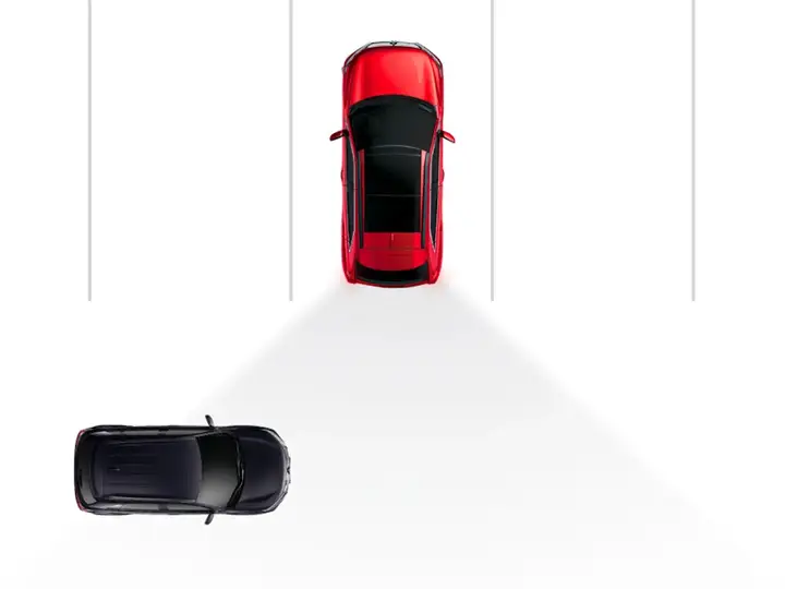 a 2025 red mitsubishi eclipse cross parked about to back up with rear cross traffic alert on