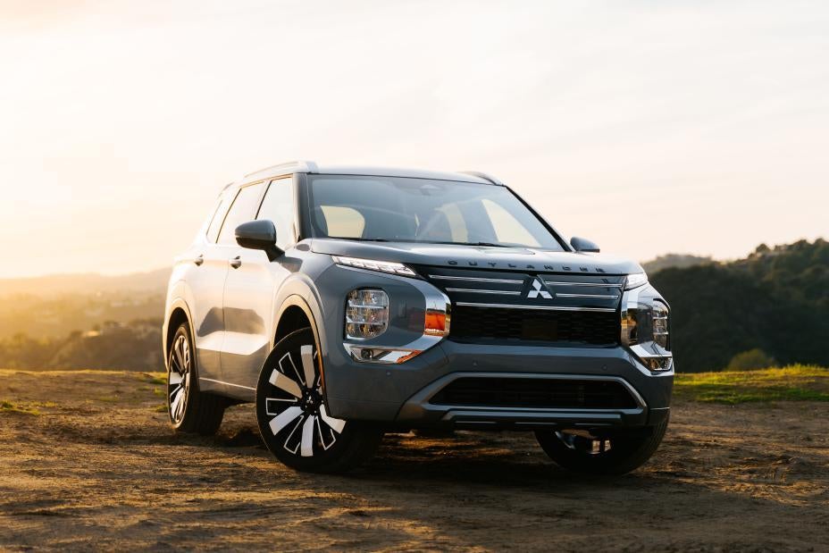 A silver suv sitting parked.