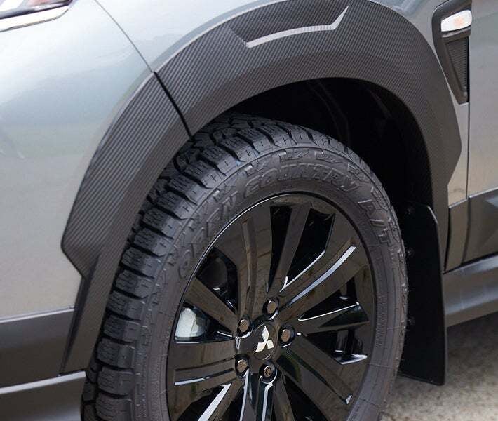 2026 Mitsubishi Outlander Sport Trail Edition driving on a West Texas ranch road