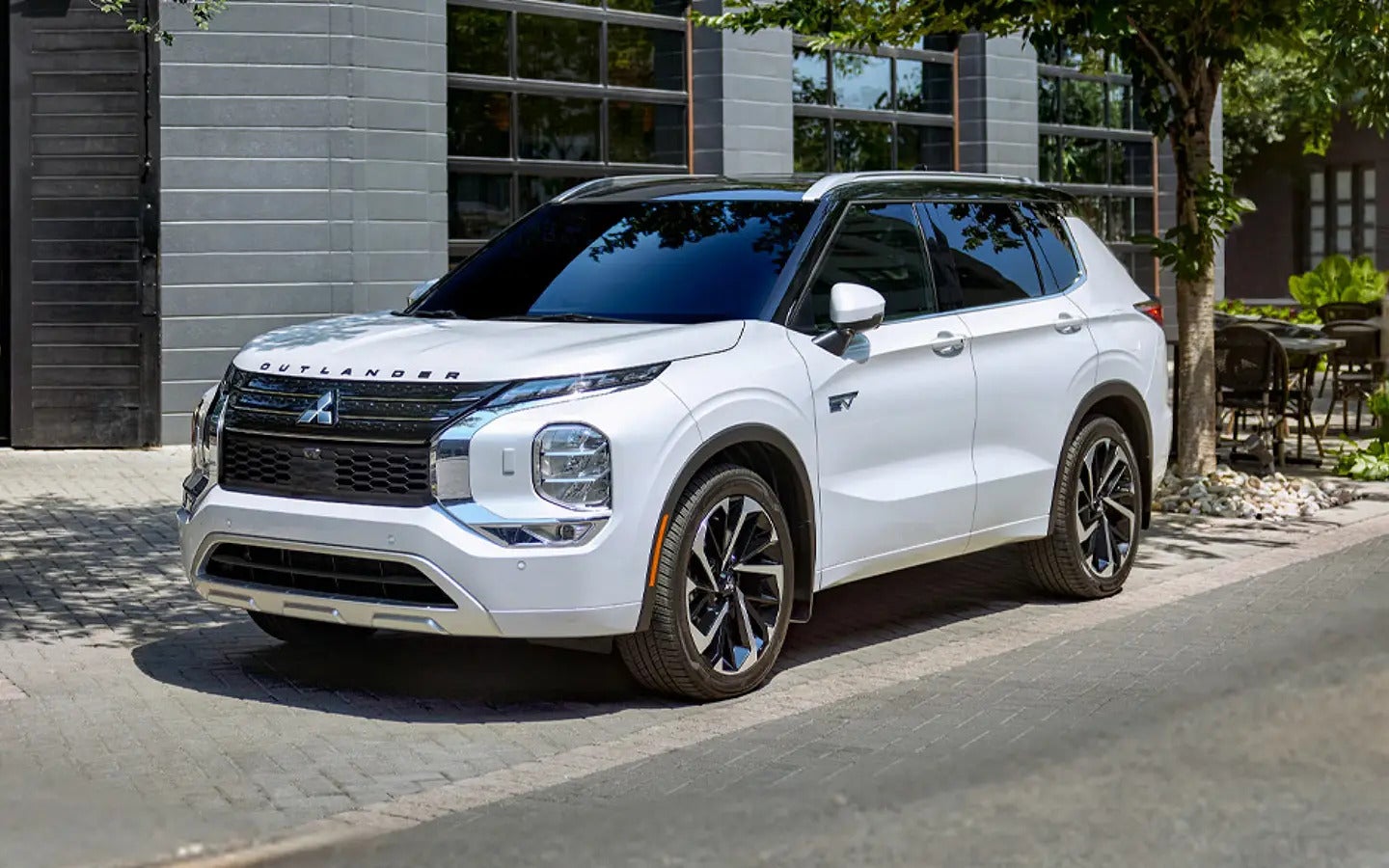 a white suv parked on a side driveway